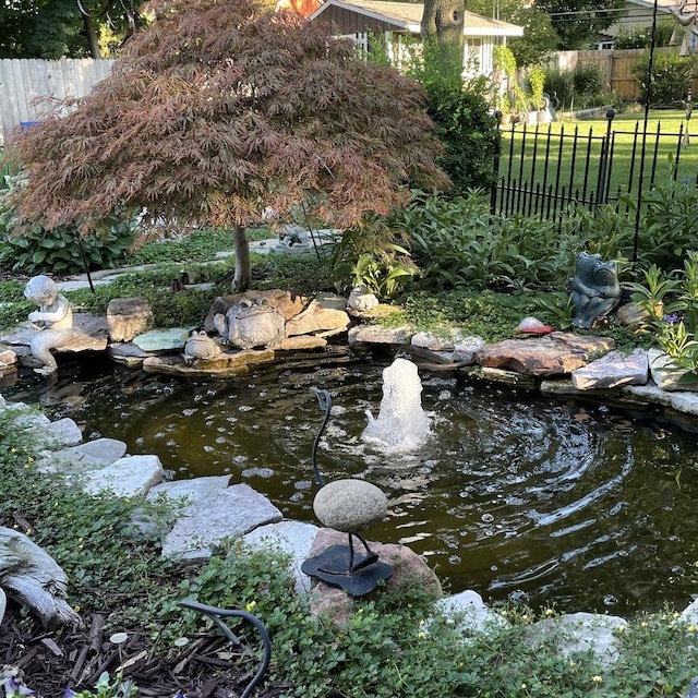 exterior space featuring a garden pond