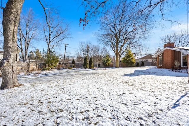 view of yard covered in snow