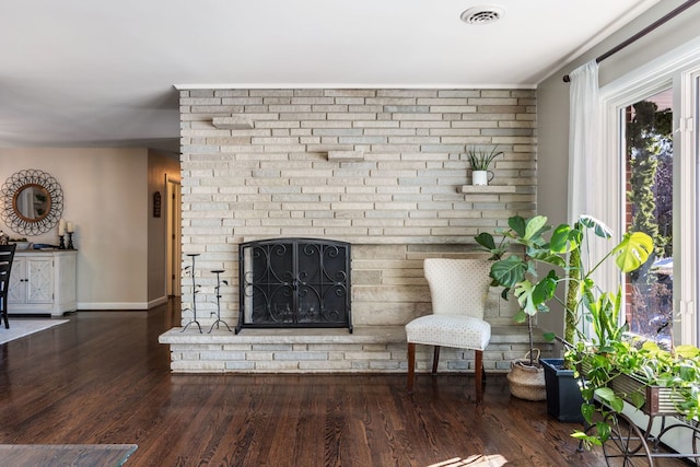 unfurnished living room with dark hardwood / wood-style flooring and a fireplace