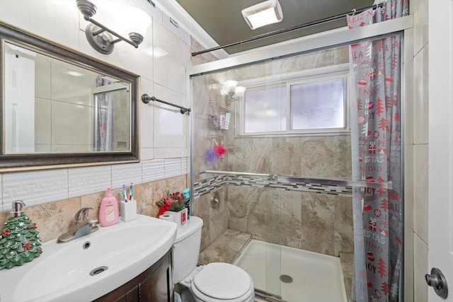 bathroom featuring sink, tile walls, tasteful backsplash, curtained shower, and toilet