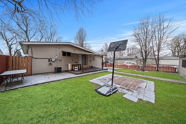 back of property featuring a yard and a patio area