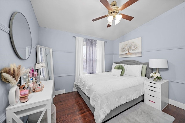 bedroom featuring dark wood-type flooring, ceiling fan, and vaulted ceiling