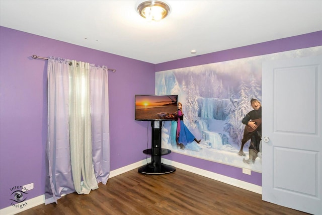 bedroom with dark wood-type flooring