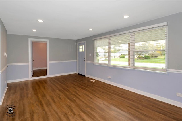 spare room featuring dark hardwood / wood-style flooring