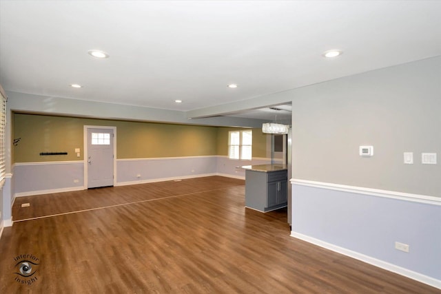 empty room featuring dark wood-type flooring