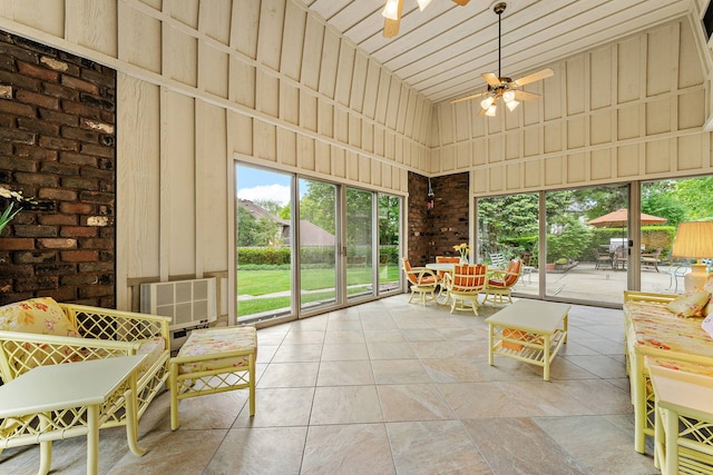 unfurnished sunroom featuring plenty of natural light and ceiling fan