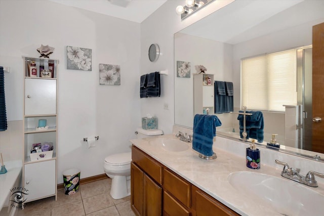 bathroom featuring vanity, tile patterned floors, and toilet