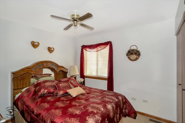 bedroom with ceiling fan and carpet