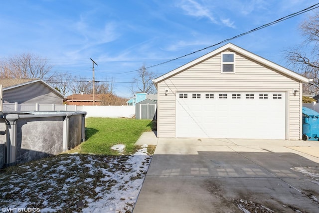 view of property exterior featuring a garage, a yard, and a storage shed