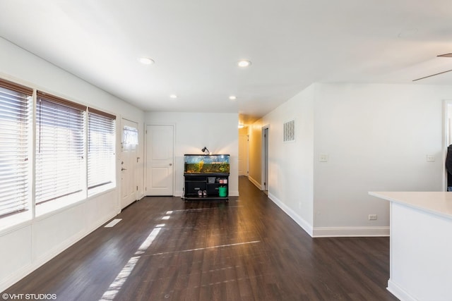 unfurnished living room with dark hardwood / wood-style flooring