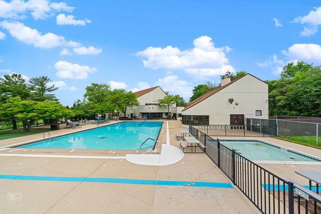 pool featuring a patio area and fence