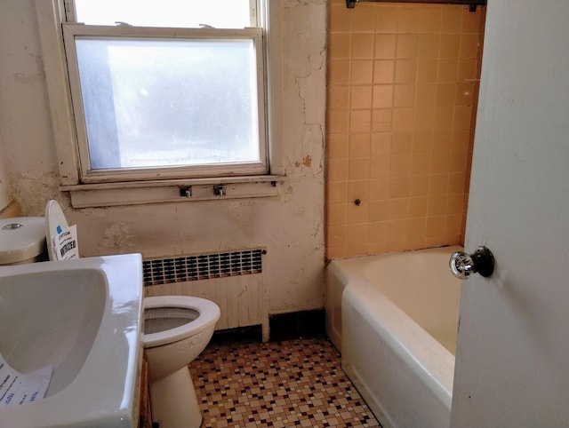 full bathroom with radiator, sink, tile patterned flooring, toilet, and bathing tub / shower combination