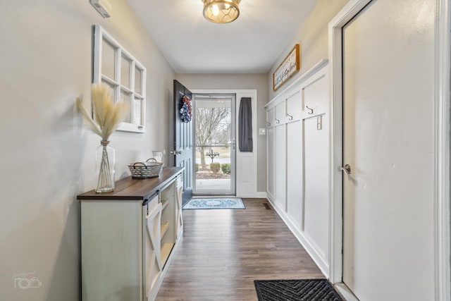 doorway with dark wood-style floors