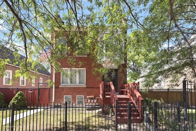 view of jungle gym with a fenced front yard and a lawn