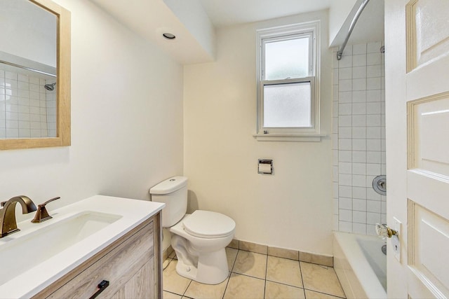 full bathroom featuring toilet, washtub / shower combination, vanity, tile patterned flooring, and baseboards