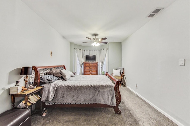 carpeted bedroom with ceiling fan, visible vents, and baseboards