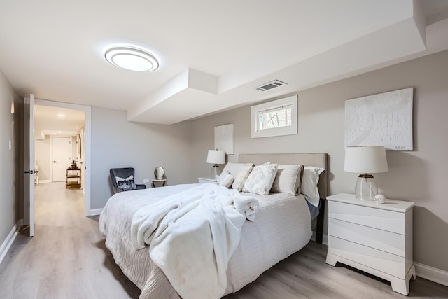 bedroom with light wood-type flooring