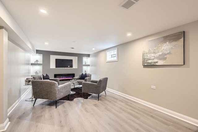 living room with light hardwood / wood-style floors