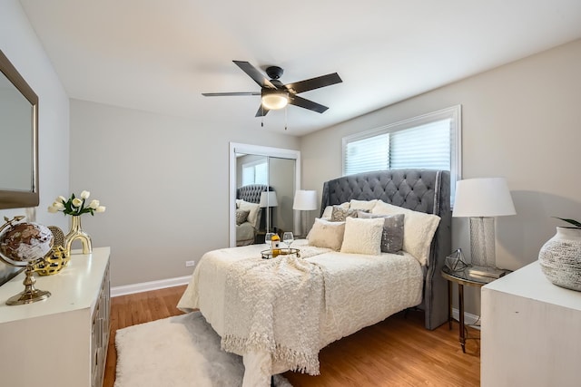 bedroom featuring a closet, ceiling fan, and light hardwood / wood-style floors