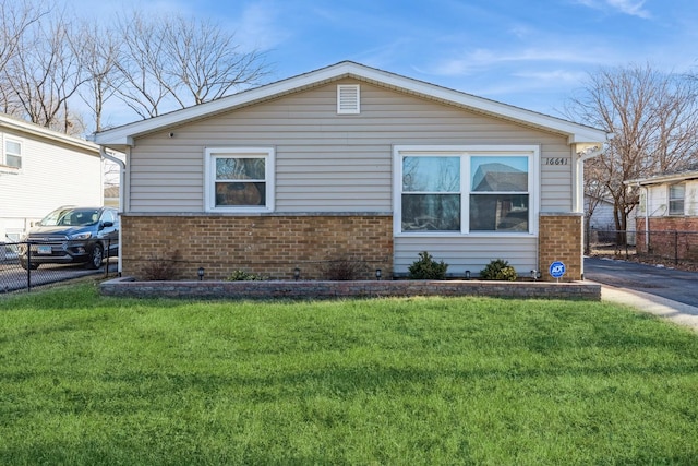 view of side of property featuring a yard