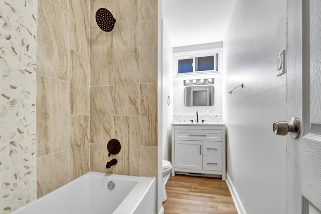 full bathroom with vanity, toilet, bathing tub / shower combination, and hardwood / wood-style floors