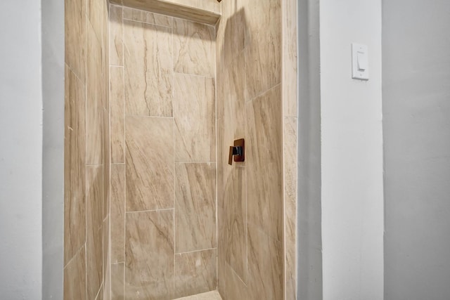 interior space featuring tiled shower