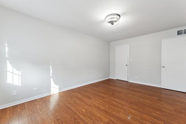 unfurnished room featuring hardwood / wood-style flooring