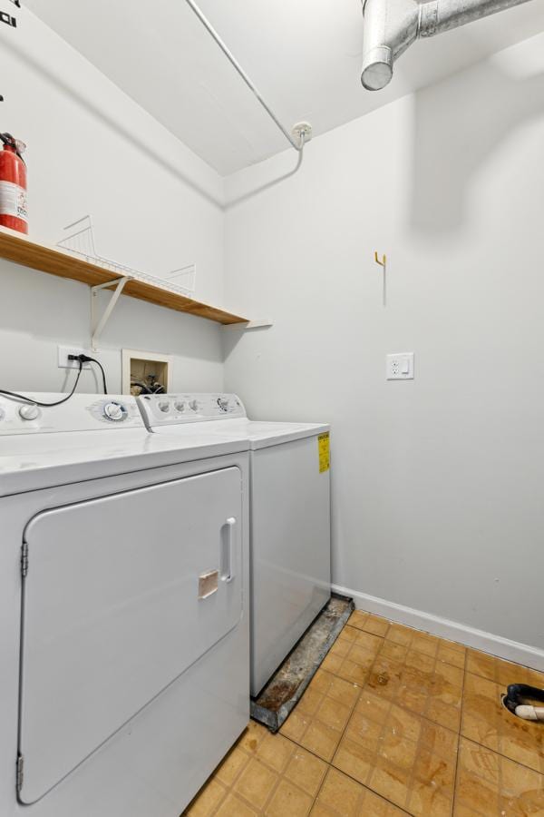 clothes washing area with independent washer and dryer