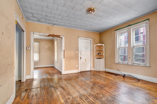 unfurnished room featuring hardwood / wood-style flooring