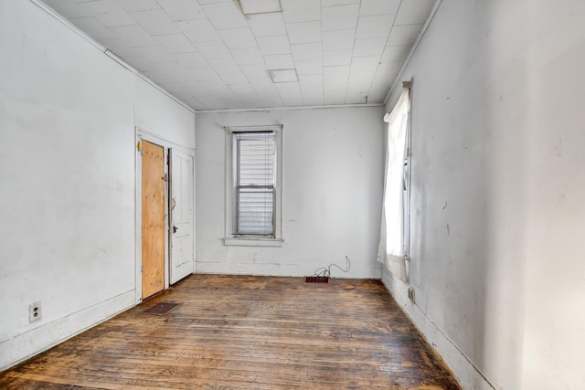 unfurnished room featuring dark hardwood / wood-style flooring