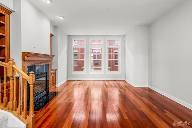 unfurnished living room with hardwood / wood-style flooring