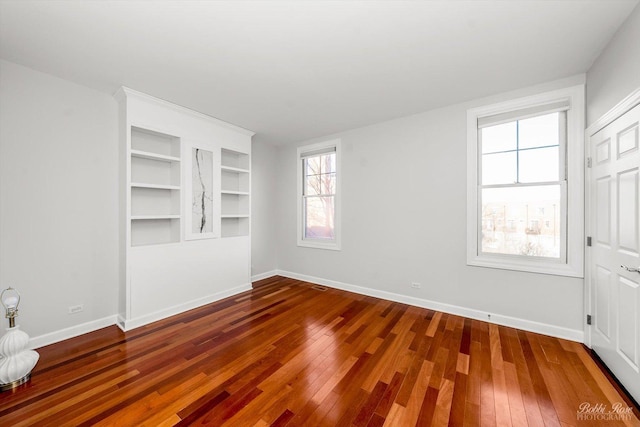 unfurnished room featuring wood-type flooring