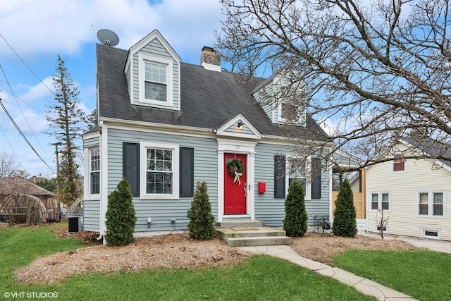 cape cod home with central AC and a front lawn