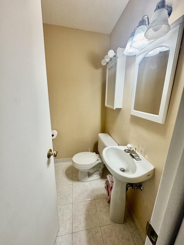 bathroom with tile patterned flooring and toilet