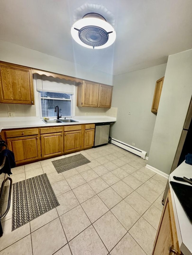 kitchen with light tile patterned flooring, a baseboard radiator, sink, backsplash, and stainless steel dishwasher