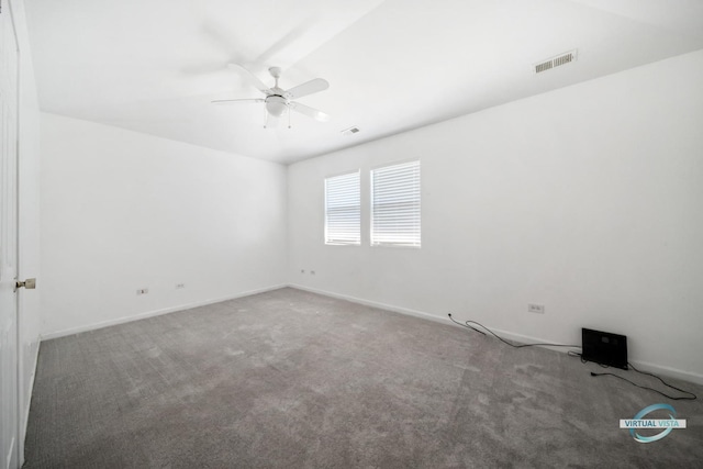 carpeted spare room with ceiling fan