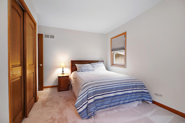 carpeted bedroom featuring a closet