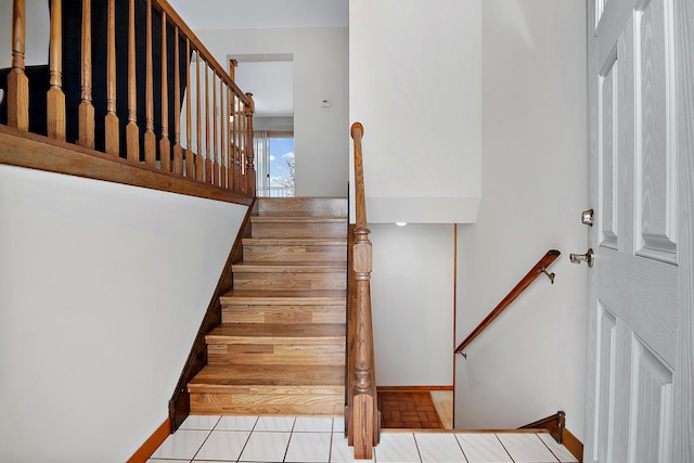 stairs with tile patterned floors