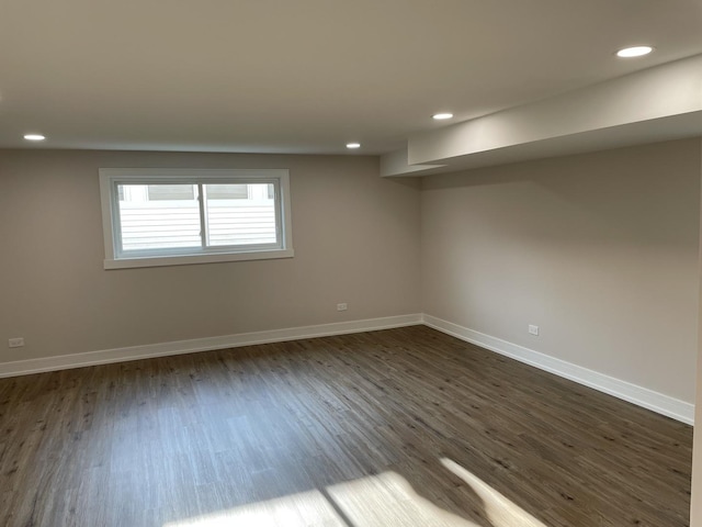 unfurnished room featuring dark hardwood / wood-style flooring