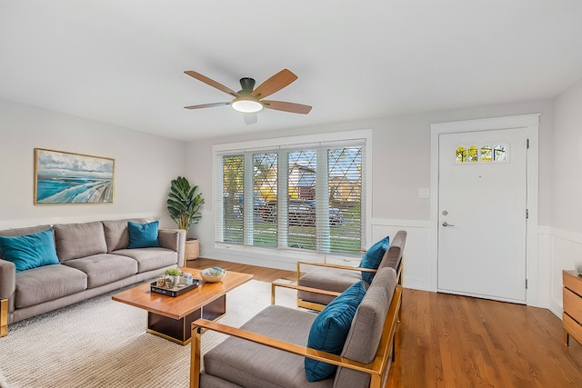 living room with hardwood / wood-style floors and ceiling fan