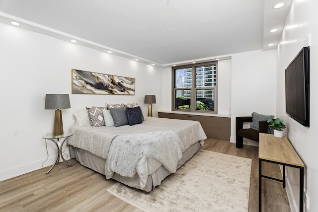 bedroom with light wood-type flooring