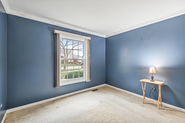 carpeted spare room with ornamental molding