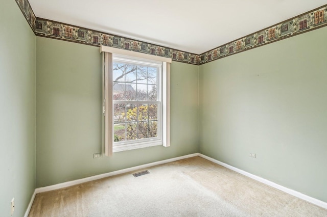 empty room featuring carpet flooring