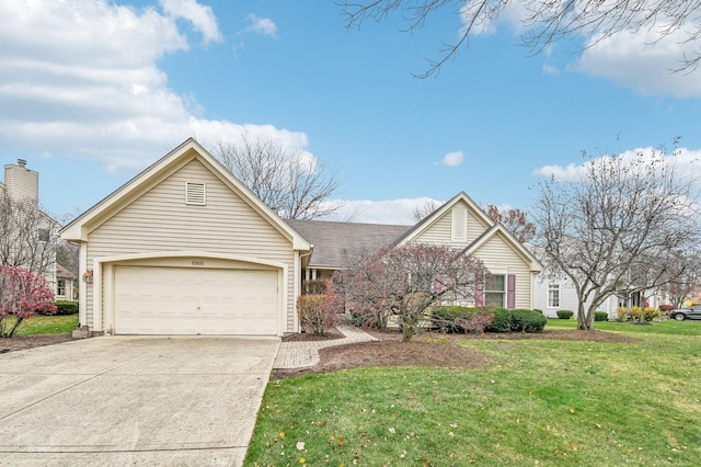 view of front of home featuring a garage and a front lawn