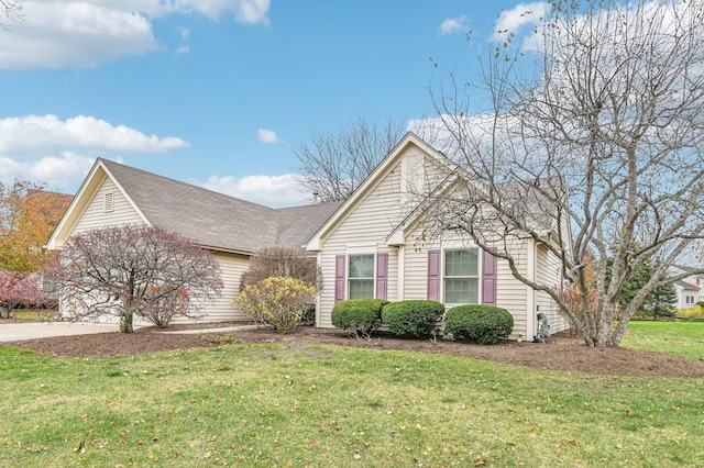 front of property featuring a garage and a front yard