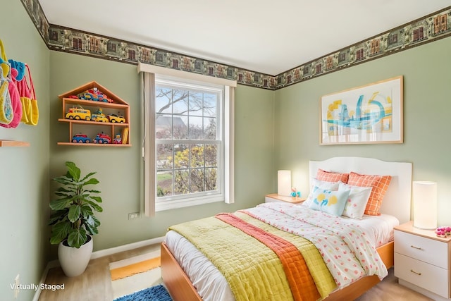 bedroom featuring light hardwood / wood-style flooring