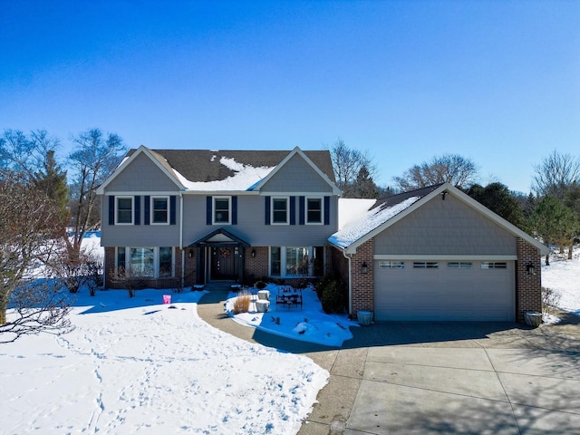 view of front of property with a garage, concrete driveway, and brick siding