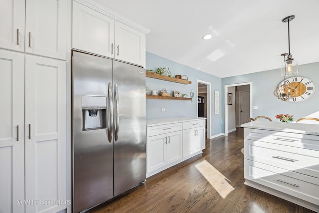 kitchen featuring pendant lighting, dark wood-style flooring, stainless steel refrigerator with ice dispenser, open shelves, and white cabinetry