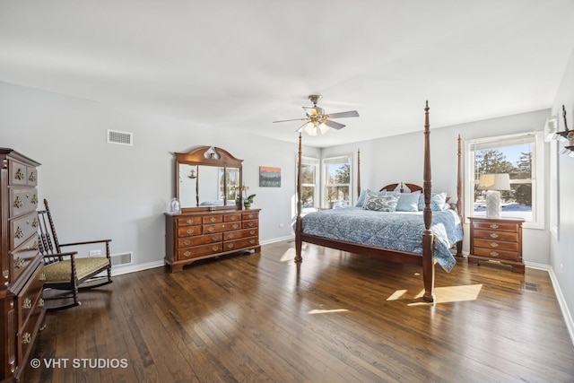 bedroom featuring visible vents, dark wood finished floors, baseboards, and multiple windows