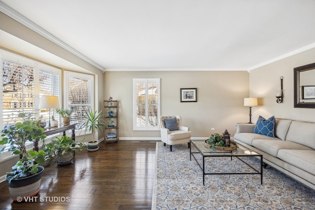 living area with baseboards, wood finished floors, and crown molding